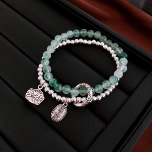 Detail of New Chinese style double-layer jade and silver bead bracelet with lotus charms