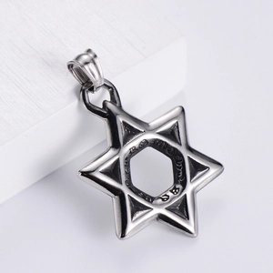 Polished stainless steel Star of David pendant on a minimalist white textured pedestal