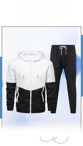 Detailed close-up of men's two-piece tracksuit featuring V-shape patchwork and hooded design