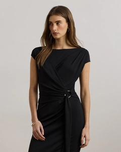Detail of waist metal ring and elegant ruched texture on this black slim dress
