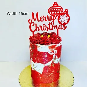 Red acrylic Merry Christmas cake topper with snowflake design, width 15cm on a festive cake