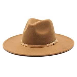 Detail of classic brown wool fedora hat with wide brim and gold metal buckle band