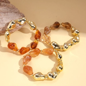 Bohemian irregular acrylic beaded bracelet set with gold metallic accents and amber resin