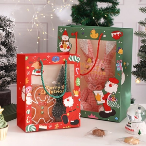 Christmas gift bag with transparent window and Merry Christmas print in festive setting