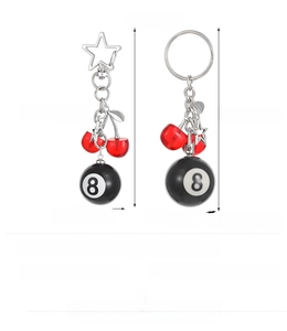 Detailed view of resin 8-ball billiard keychains with star pendants and size measurements
