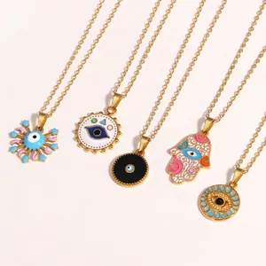 Set of five gold titanium steel necklaces featuring enamel evil eye and hamsa hand pendants