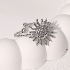 Minimalist silver stainless steel open sun ring with hammered texture and sunburst design