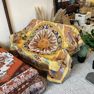 Bohemian yellow knit sofa throw blanket with sun face pattern and tassel fringe details