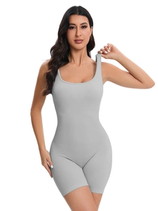 Close-up of light grey ribbed seamless bodysuit featuring a deep U-neck and wide straps