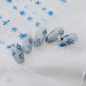 5D embossed snowflake nail art stickers with blue textures, pearls and rhinestones decoration