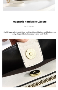 Close-up of magnetic buckle closure and leather texture on black and white shoulder bag