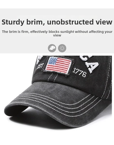 Detail of vintage washed black cotton baseball cap featuring 1776 American flag embroidery