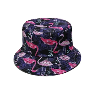 Detail view of purple bucket hat with pink flamingo and blue tropical leaf prints