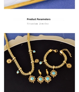 Detailed view of titanium clover jewelry set with blue turquoise and ginkgo leaf pendants