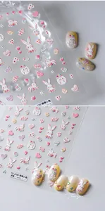 Detail of 5D embossed rabbit and heart nail stickers with 3D texture on yellow nails