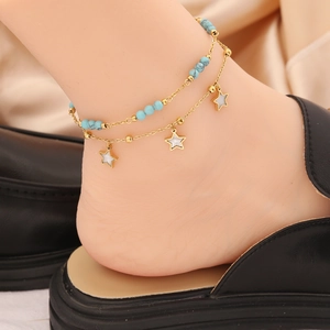 Bohemian gold double layer anklet with turquoise beads and white star pendants on model