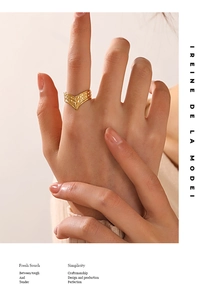 Macro shot of V-shaped 18K gold plated stainless steel ring with elegant textures