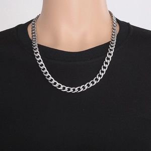 Detailed view of 60cm long and 9.5mm wide silver Cuban link chain worn on neck