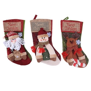 Three-piece set of vintage Christmas stockings with Santa, Snowman and Reindeer characters