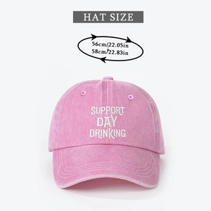 Detail of pink washed cotton baseball cap with Support Day embroidery and size guide