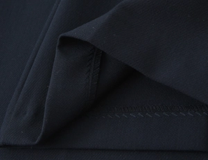 Macro shot of high-quality creped fabric texture and precise stitching on fashion sets