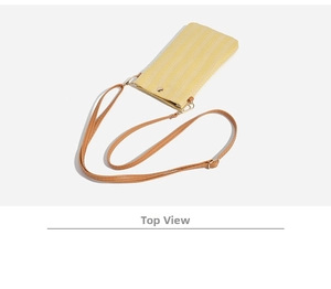 Top view of yellow woven phone bag with brown leather strap and gold metal hardware