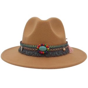 Close-up of Western cowboy hat with turquoise stone, embroidery, and tassel detail
