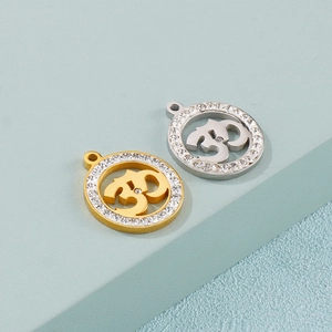 Golden and silver stainless steel Om pendants with shimmering cubic zirconia borders