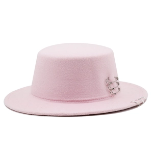 Pink wool felt boater hat featuring silver safety pins and metal rings decoration