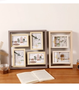 Detail view of multi-aperture wooden photo frames for 4x6 inch pictures on a desk