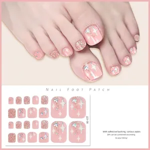 Macro detail of pink glitter foot nail patches with silver star pattern for DIY pedicure