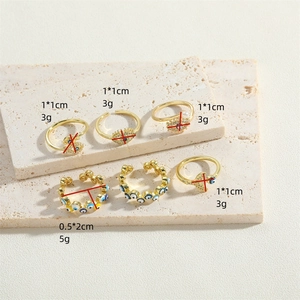 Golden Evil Eye rings and ear cuffs set with blue enamel and fine zircon accents