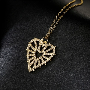 18K gold plated hollow heart pendant necklace with zircon eye detail on black leather