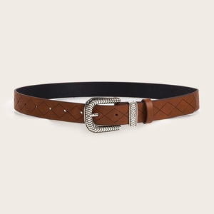 Brown textured leather belt with vintage floral engraved silver buckle on beige background