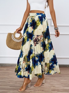Detail of high-waist pleated skirt with abstract oil painting print in blue and yellow