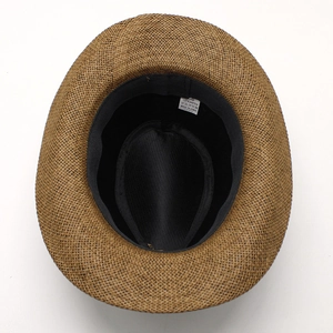 Detail showing the internal label, 58cm size, and breathable paper straw material on cowboy hat