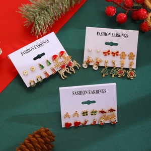 Christmas earring set detail with Santa Claus, reindeer and snowflake on display card