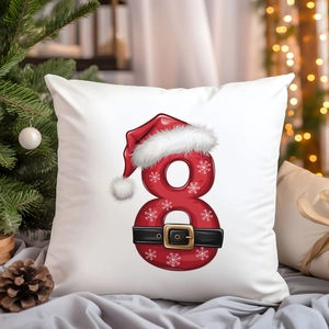 Detail of Christmas pillow cover featuring festive number 8 with snowflake and belt