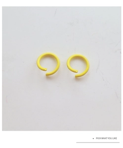 Detailed close-up of a matte yellow lacquered open C-ring connector for DIY jewelry making