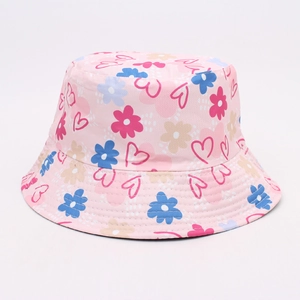 Detail of pink cotton bucket hat featuring colorful flower and red heart pattern print
