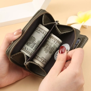 Deep green compact leather wallet with tassel zipper and multi-card slots for women