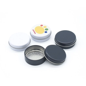 Macro view of round metal tins showing interior space and portable lid design