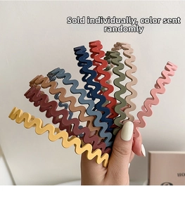 Close-up of wavy non-slip matte hairbands in assorted Morandi colors for hair styling