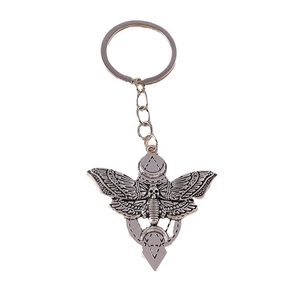 Retro Halloween skeleton moth keychain with crescent moon pendant in vintage silver metal
