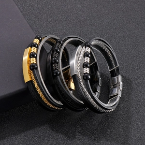 Detail of multi-layer men's leather woven bracelets with stainless steel beads