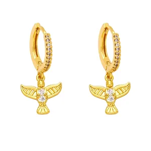 Golden owl drop earrings with crystal wings and engraved details on white background