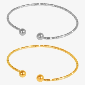 Minimalist 18k gold and silver stainless steel open bangle with geometric faceted texture