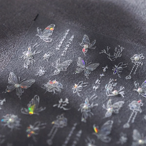 Holographic butterfly nail stickers with 3D floral designs and pearlescent accents
