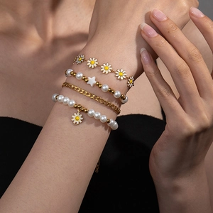 Bohemian daisy and pearl bracelet set for women, featuring 4 pieces of gold chain jewelry