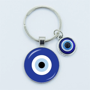 Silver alloy keychain with blue evil eye charms on a clean white background